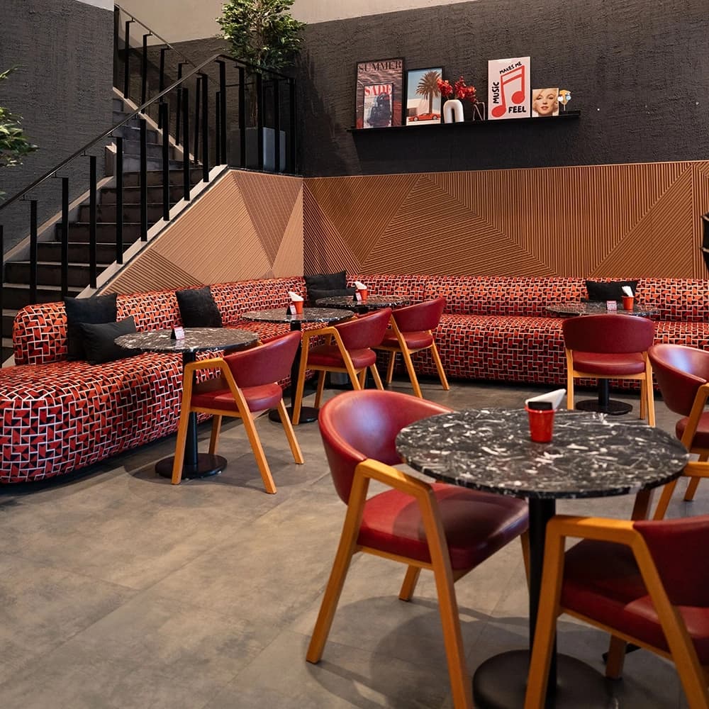 Cozy restaurant dining area with intimate booth seating and ambient lighting